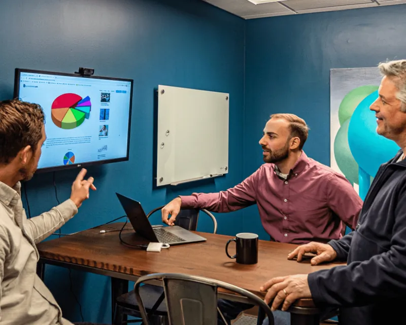 LakeRidge team members talking through a dashboard
